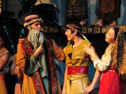 Actors on stage in Joseph and the Amazing Technicolor Dreamcoat 